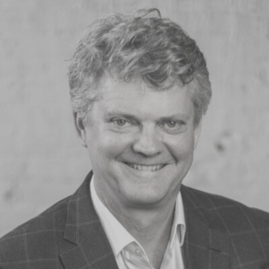 Profile head shot in black and white of Chris Dykstra, Founder, GoodCarts.