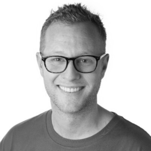 Profile head shot of Jordan Lewis Co-Founder of Spotrisk. A white male, short hair and glasses approx. mid thirties.